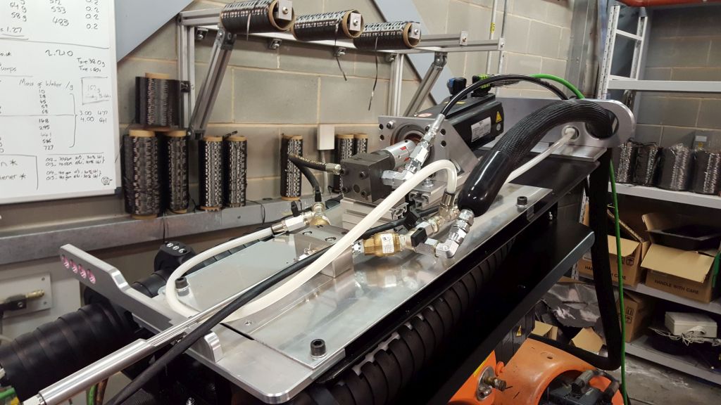 A metering pump mounted directly onto robot arm in a chopped fibre application Credit: University of Nottingham